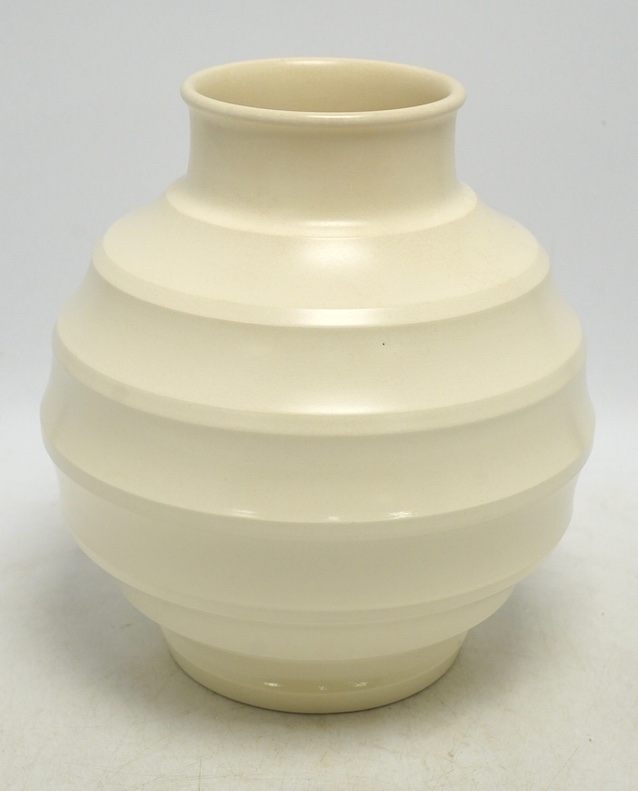Keith Murray for Wedgwood, a cream glazed ribbed globular vase, 23cm. Condition - fair, star crack visible to base from interior